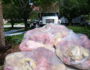 Bags of fiberglass batting removed from an attic.