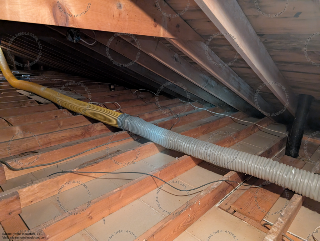 Vacuum hoses for removing vermiculite insulation that contains asbestos